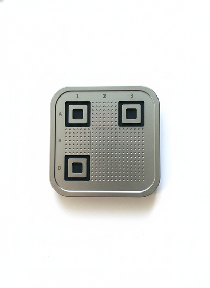 Metallic square device with QR code patterns on a white background