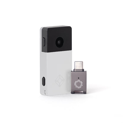 Silver Blockstream Jade Plus Bitcoin hardware wallet with USB-C adapter for air-gapped upgrades and featuring QR-signing camera 